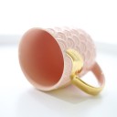 Mug en céramique avec des ailes dorées 3