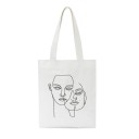 Naisten kangaskassi minimalistisella kasvojen viivapiirroksella Ostoskassi 35 x 40 cm Kahvat 30 cm Valkoinen kassi hienolla viivapiirroksella 4