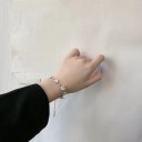 Naisten rannekoru päivänkakkaroilla 2