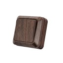 Nástěnný vypínač jednoklapkový, povrchová montáž 69x69x34 mm, plast zpomalující hoření, hnědý dřevodekor, do chodby, ložnice i koupelny 1