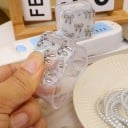 Ochrannym obalem na ładowarkę Apple 18W/20W z dekoracją kokardek, zestaw z oplotem, osłonkami i paskiem zaciskowym 7
