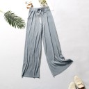 Pantalones holgados de mujer con cintura elástica. 7