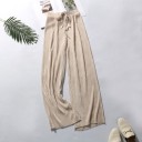 Pantalones holgados de mujer con cintura elástica. 10