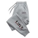Pantaloni de trening pentru femei cu inscripția LOVE pe lateral și pe picioare, cu șnur, din poliester, uni, confortabili 1