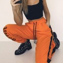 Pantaloni sportivi arancioni da donna con scritta 1