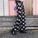 Pantalons dames noir et blanc avec des fleurs 2