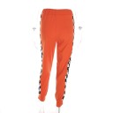 Pantalons de jogging à carreaux orange pour femmes avec zip 4