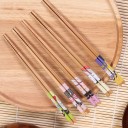 Paus de comida de bambu com motivo de geisha para pratos asiáticos Conjunto de 5 pares Cada par com uma estampa diferente Pontas estriadas Comprimento 1