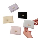 Portafoglio da donna 11 x 8 x 2 cm con fiocchetto Superficie trapuntata Pelle sintetica morbida e fine Design compatto ed elegante 4