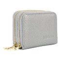 Portafoglio piccolo da donna in vera pelle Due scomparti con zip Superficie granata Anelli sui cursori delle zip Dimensioni 11 x 7,5 x 4,5 4