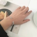 Pulseira aberta feminina com asas 2