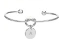 Pulseira aberta feminina com letra E