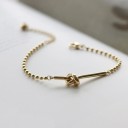 Pulseira de bolas feminina com nó 2