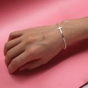 Pulseira de bolas para senhora com cruz 2