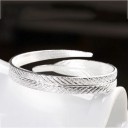 Pulseira rígida feminina pena 2