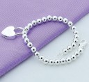 Pulsera de mujer con bolas y corazón 4