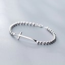 Pulsera de mujer con bolas y cruz 1