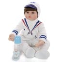 Realistische Jungenpuppe 60 cm Reborn Baby mit braunen Haaren und braunen Augen Matrosenbekleidung mit Mütze Flasche und Schnuller im Paket 1