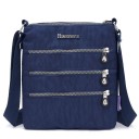 Sac à bandoulière plat pour femme en nylon Trois poches zippées à l'avant Poches intérieures Sangle réglable Dimensions 21 x 25 x 3 cm 7