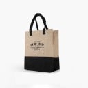 Sac en lin pour femmes avec une partie inférieure noire et des anses noires Inscription typographique au centre Forme haute avec des côtés 1