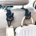 Set aus zwei Autohaltern in Form eines Katzenkopfes für die Kopfstütze, als würde eine Katze eine Tasche, Brille oder Kleidung im Mund halten 5