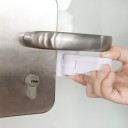 Självhäftande lås på handtaget 3