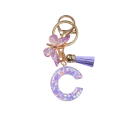 Sleutelhanger 4 cm Hars sleutelhanger Paarse initialen en vlinder Decoratieve versiering voor handtas rugzak Cadeau voor vrouwen 4