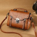Small women's handbag for hand or shoulder use Bag made of synthetic leather with a flap Metal fastening Detachable strap Dimensions 22 x 15 2