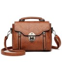 Small women's handbag for hand or shoulder use Bag made of synthetic leather with a flap Metal fastening Detachable strap Dimensions 22 x 15 5