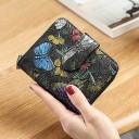 Small women's wallet made of genuine leather with a colourful embossed floral pattern Zip around and fastening with a loop Dimensions 11.5 x 9 x 3 3