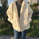 Sudadera de mujer con cremallera y capucha con cordones Corte oversize holgado Hombros caídos Dos bolsillos frontales Puños de canalé 1