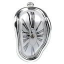 Table Clock in the Shape of a Melting Clock Face for the Edge of a Shelf or Table Roman Numerals Plastic Body Dimensions 18 x 12 x 5 cm Powered 3
