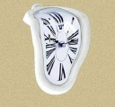 Table Clock in the Shape of a Melting Clock Face for the Edge of a Shelf or Table Roman Numerals Plastic Body Dimensions 18 x 12 x 5 cm Powered 1