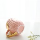 Tazza in ceramica con ali dorate 5