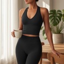 Top sportivo da donna con scollatura a V e schiena scoperta in taglio aderente allungato senza maniche per yoga, pilates e fitness 2