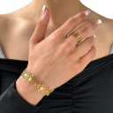 Usædvanligt retro sæt armbånd og ring Justerbar størrelse Rustfrit stål Hule blomster Fadede frie damesmykker gave 2