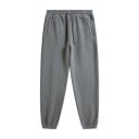 Voľné jednobarevné tepláky s elastickým pásom a sťahovacími šnúrkami doplnené bočnými kapsami a stiahnutými manžetami pri členkoch unisex 15