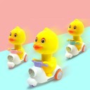 Winding Duck on Scooter 13.5 x 10.3 x 5.6 cm Yellow Figure with Rotating Head Plastic Toy for Children 4