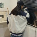 Women's Oversized Zip Jacket White with Dark Blue Panels With Stand-Up Collar Round Motif on the Chest Gathered Cuffs and Hem Loose Sleeves Side 3