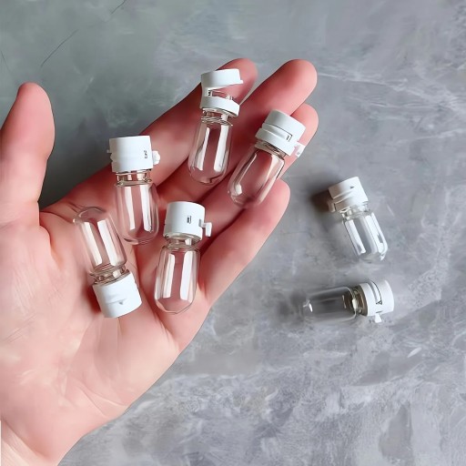 10 db-os átlátszó üvegpalack készlet, 2 ml, 3,1 x 1,3 cm, kupakkal ellátott utazódobozok arcszérumhoz, sminklemosóhoz vagy esszenciához