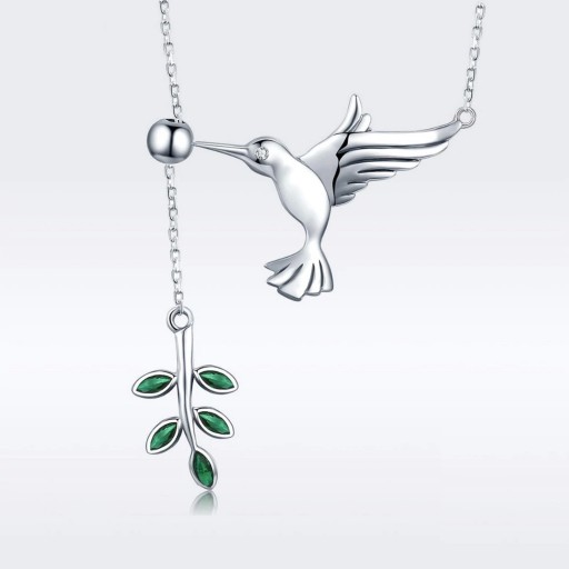 Damhalsband med en fågel och en kvist