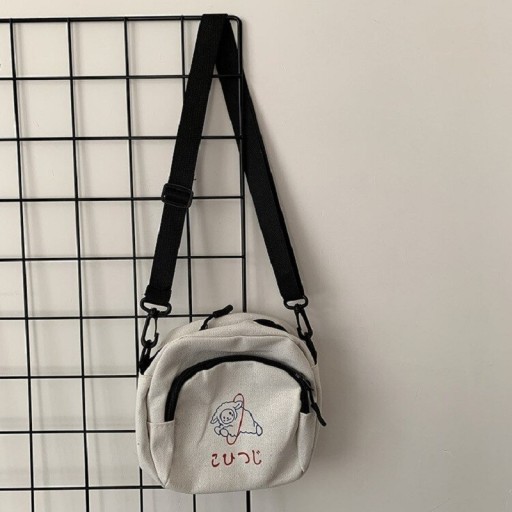 Dams liten crossbody-väska av kanvas med fårmotiv Framficka med dragkedja Svart justerbar rem med karbinhakar 15 x 16 cm