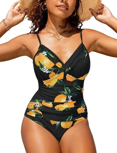 Bañador de mujer de una pieza, color negro con estampado de frutas amarillas, escote cruzado, fruncido en los laterales, efecto moldeador, tirantes ajustables.