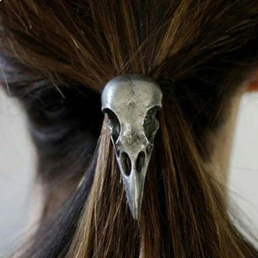 Bandă de păr cu un craniu de pasăre