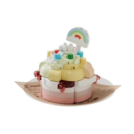 Bausatz für eine Torte in Pastellfarben 5,5 x 3,5 x 4,5 cm zarte rosa, weiße und gelbe Farben mit einem Regenbogen und kleinen Verzierungen, detaillierte miniaturisierte dekorative Torte