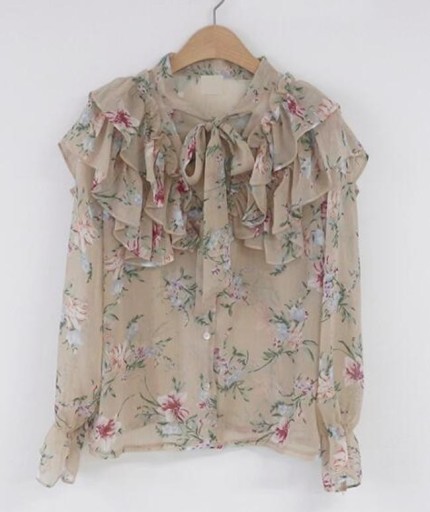 Blusa de mujer con lazo y volantes