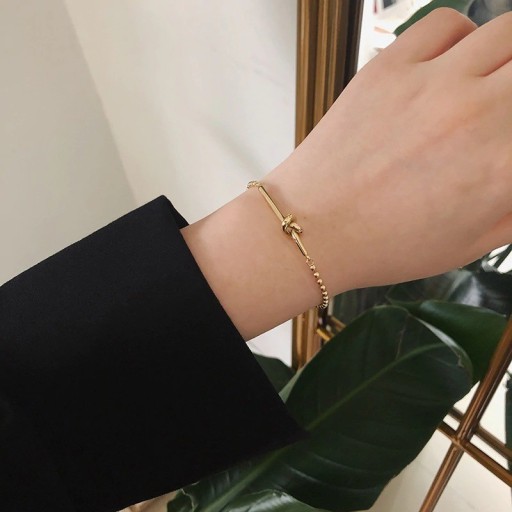 Bracelet à billes pour femme avec nœud