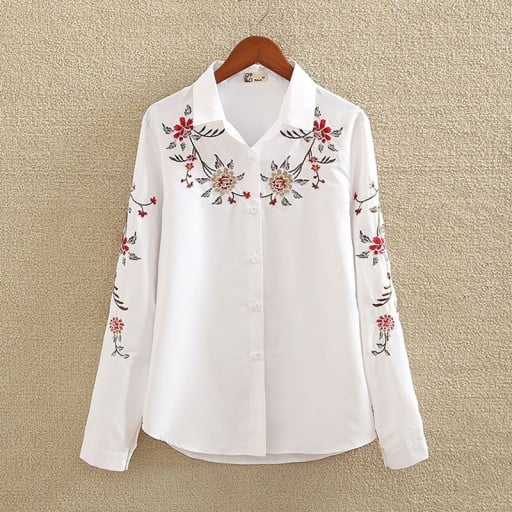 Camisa blanca de algodón para mujer con bordado floral colorido Cuello clásico Mangas largas Dobladillo redondeado Cierre de botones