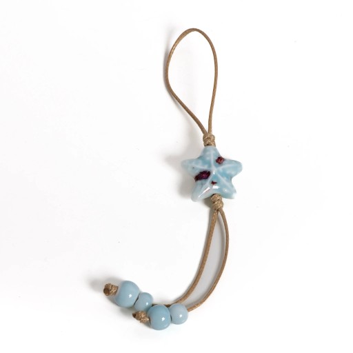 Chaveiro boho com pendente de estrela do mar