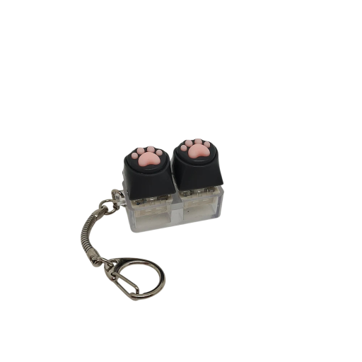 Compacte sleutelhanger met twee zachte siliconen knoppen in de vorm van een pootje. Helpt stress en spanning te verlichten tijdens werk en studie.